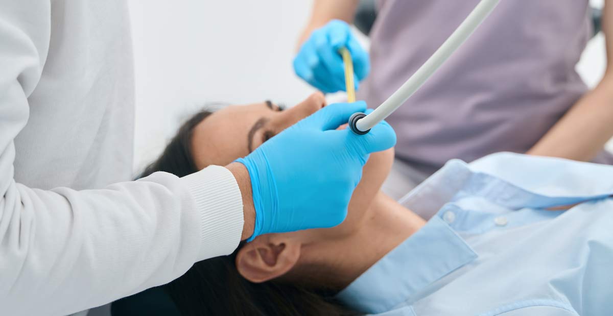 Woman in dental chair receiving treatment