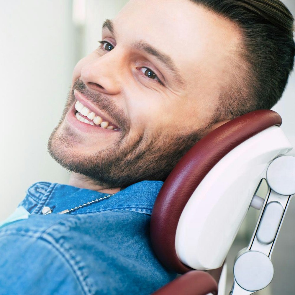 Man smiling in dental chair