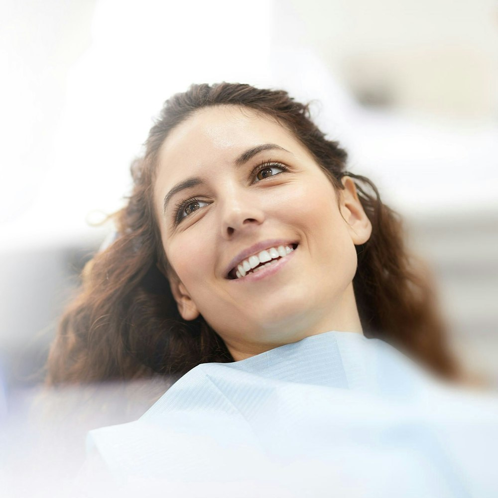 Woman smiling sitting in dental chair