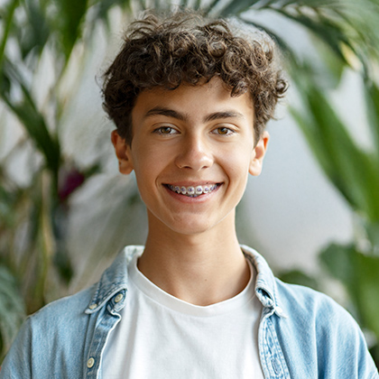Smiling teenage boy wearing braces