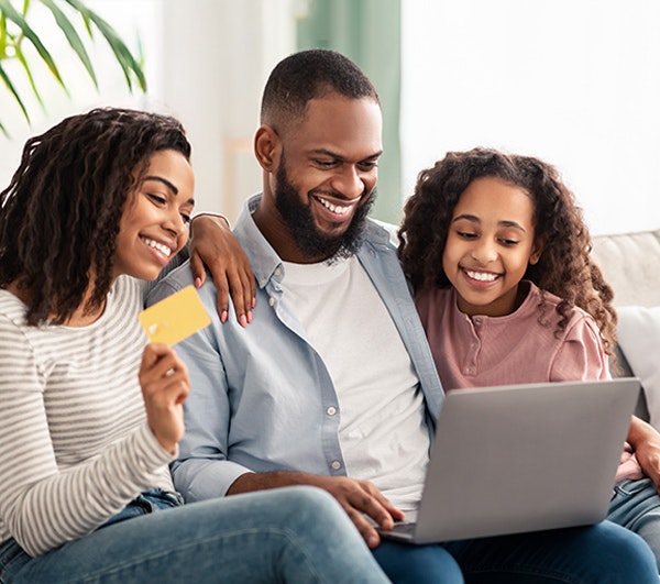 Family getting ready to make a dental payment