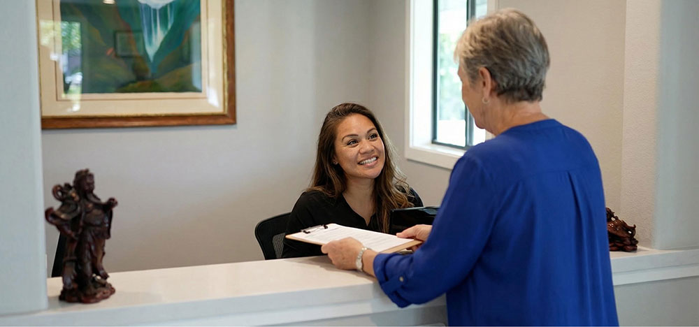 Staff greeting patient at Sweet Tooth Dental