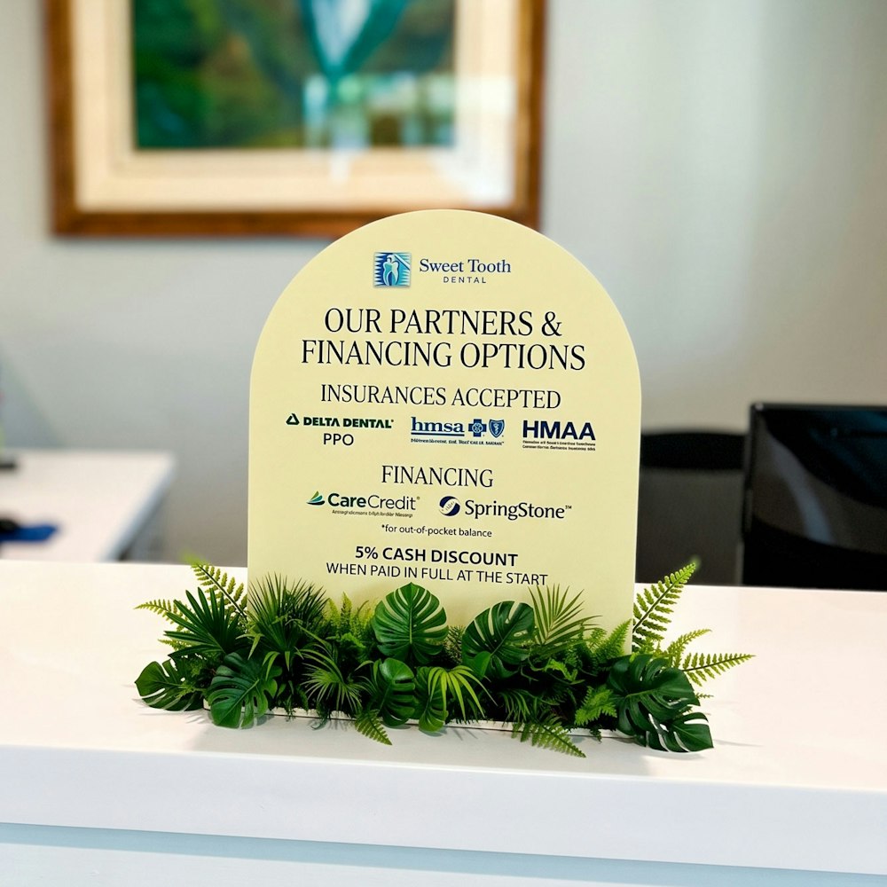 Placard in office showing insurances