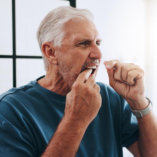 man flossing