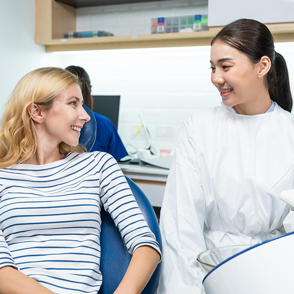 woman smiling in the dental chair