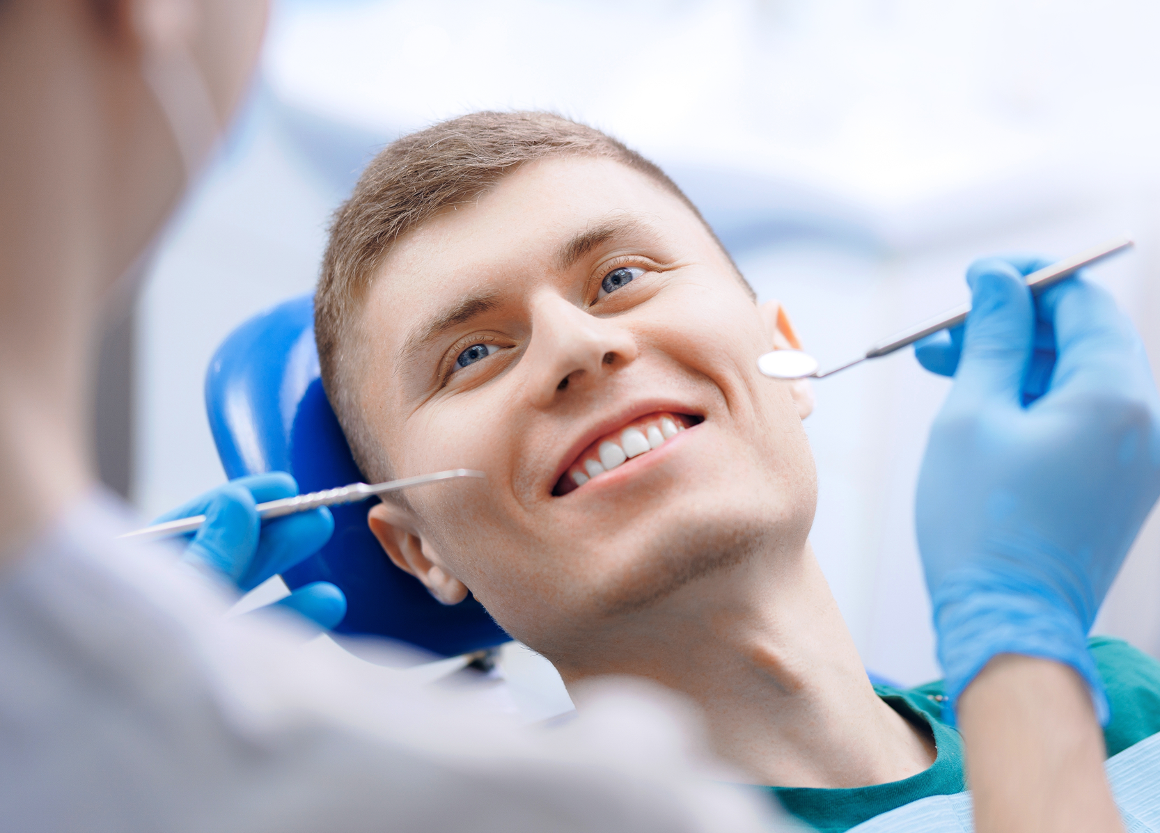 Smiling man during a dental exam