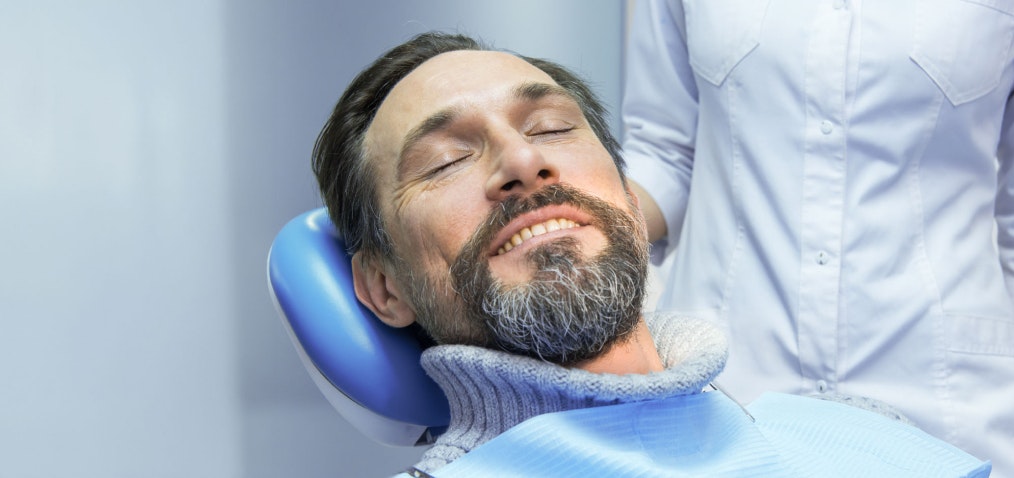 Relaxed dental implant patient in the exam chair