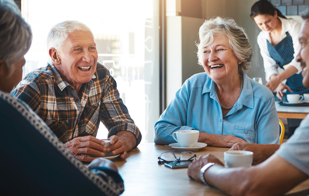 Happy senior couple having coffee