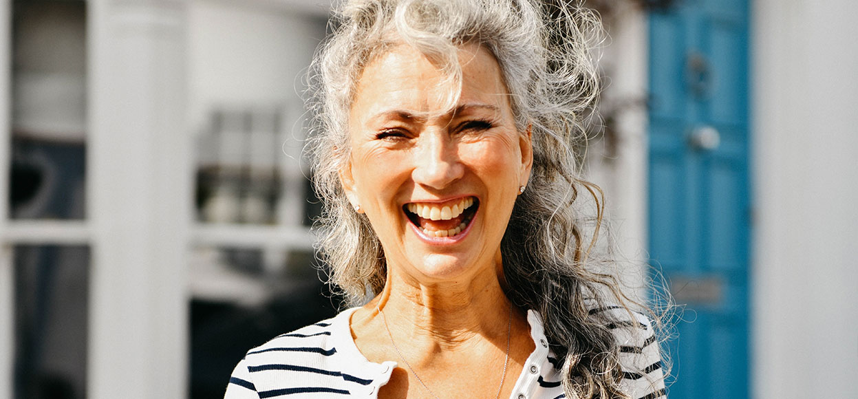 Smiling woman with dental implants
