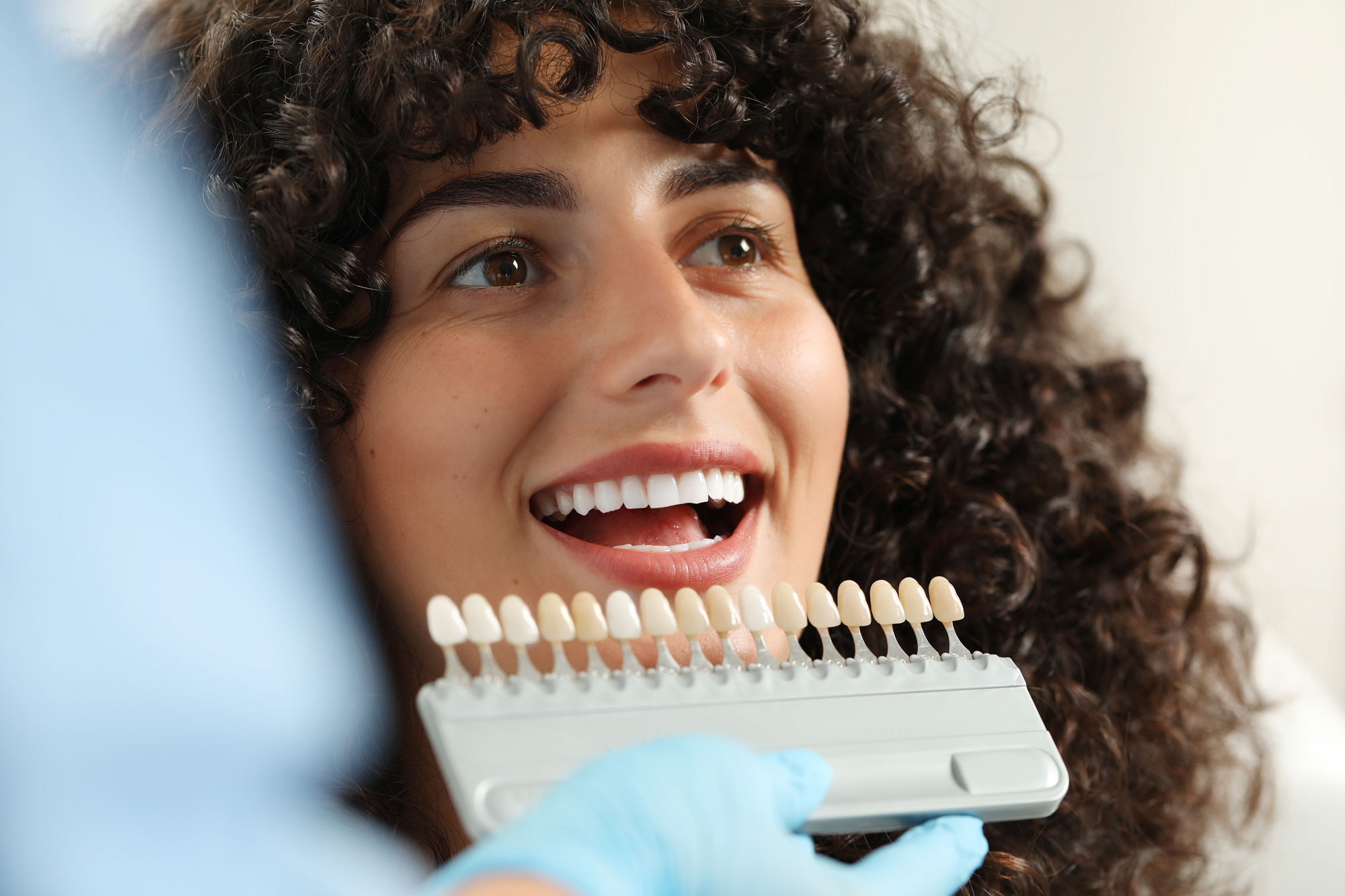 woman getting her teeth shade matched