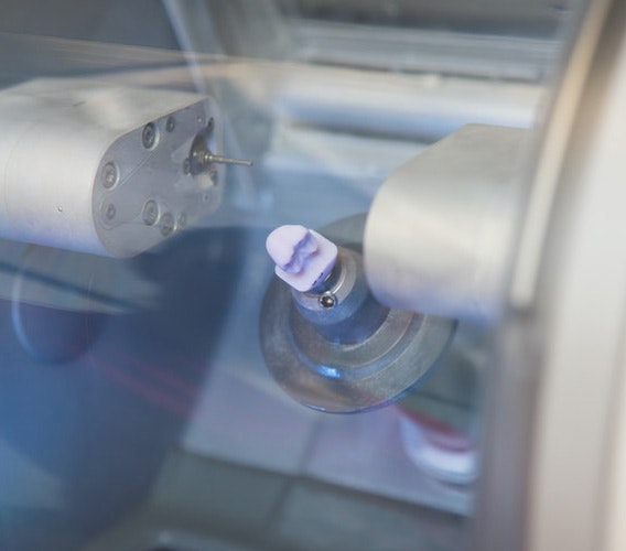 A cerec machine with the materials inside to create a dental crown