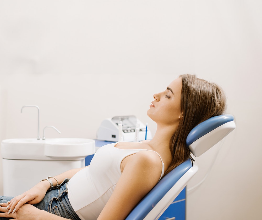 Girl sleeping in a dental chair