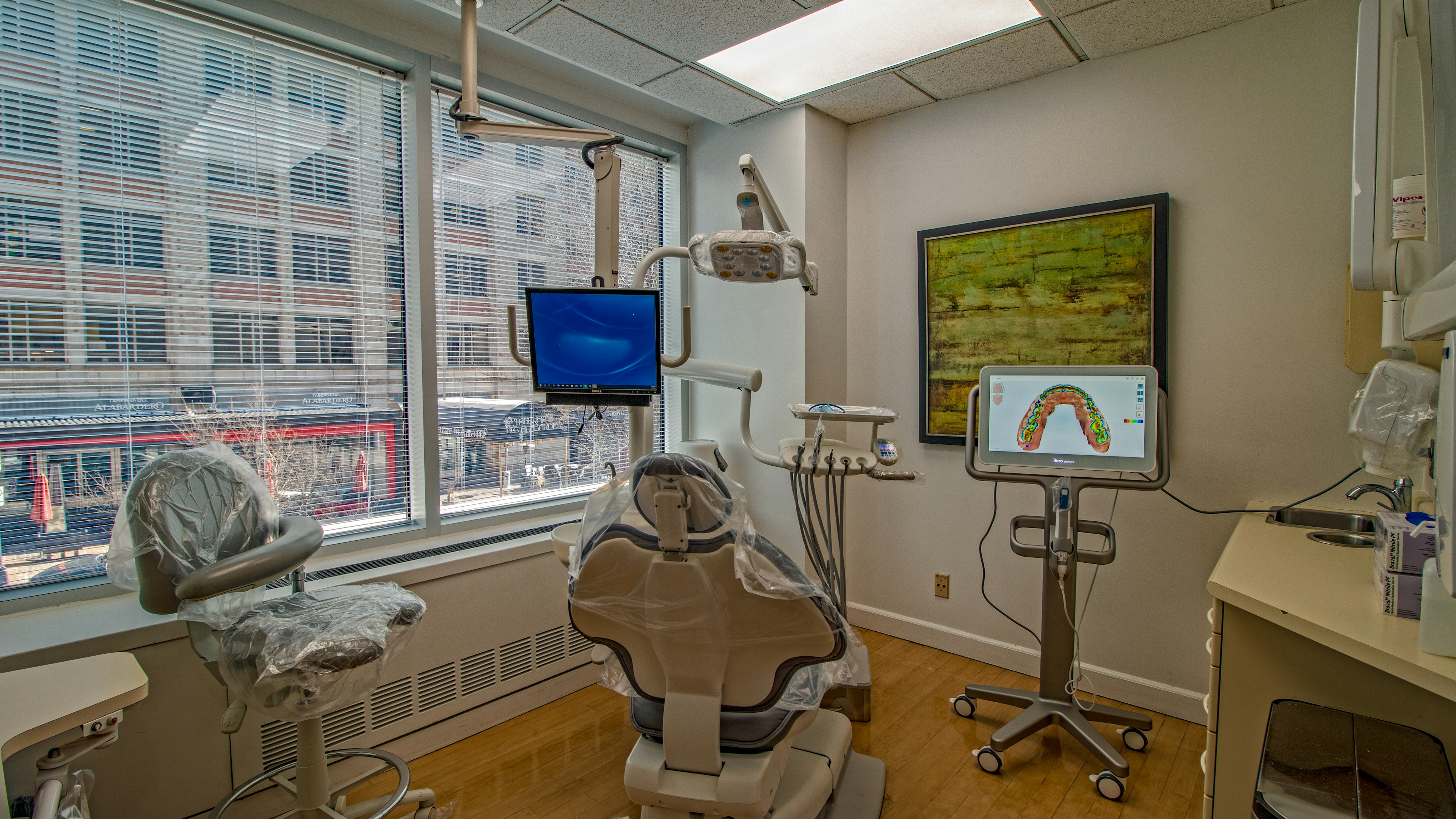 Dental technology shown next to dental chair at Thornton Dental Associates