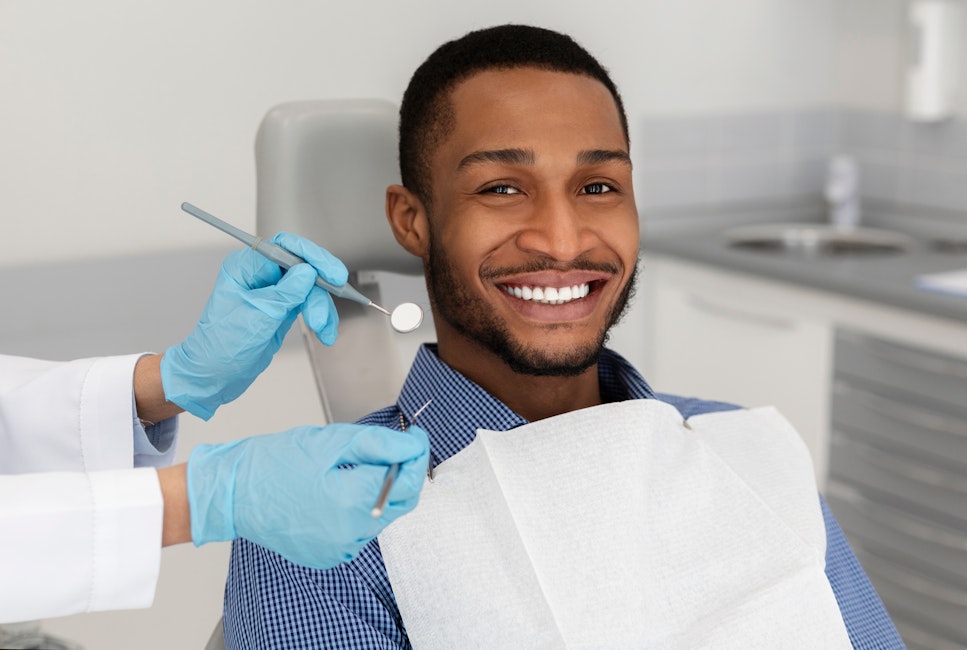 A patient visiting the dentist, smiling