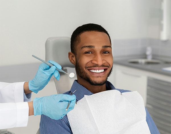 patient smiling in the dental chair
