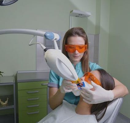patient undergoing teeth whitening treatment