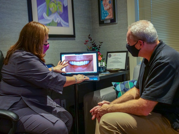 Dr. Lerch and patient going over his new smile