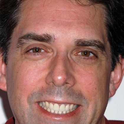 Patient with a bright, even smile after smile makeover treatment