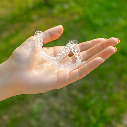 Person holding Invisalign