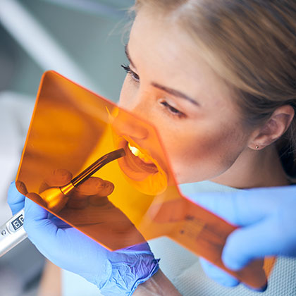 Dentist using bonding agent