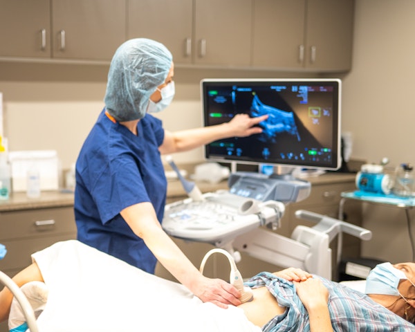 doctor performing sonogram
