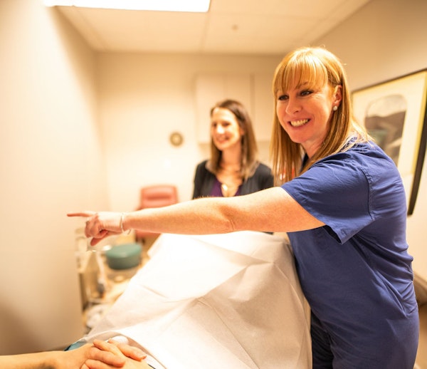 Dr. Ambler with a patient