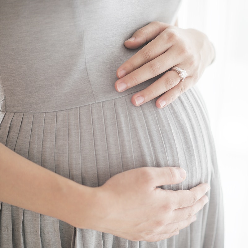 a close up of a pregnant belly