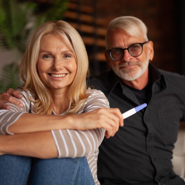 Older couple holding pregnancy test
