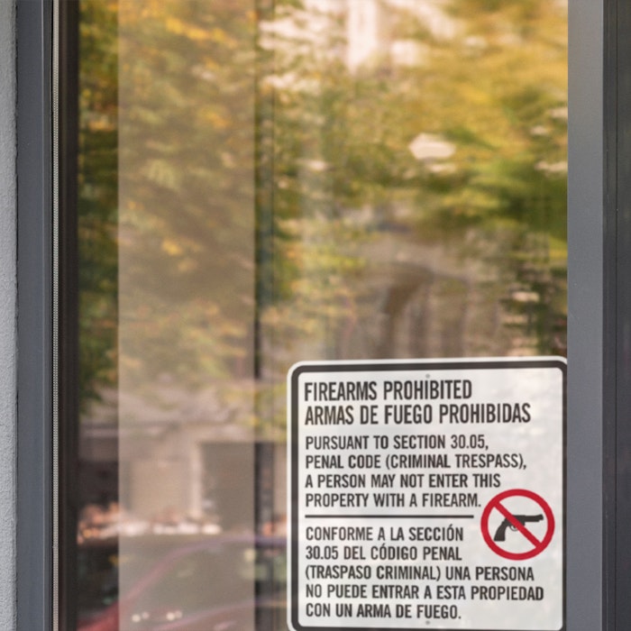 a store front with a Texas penal code sign