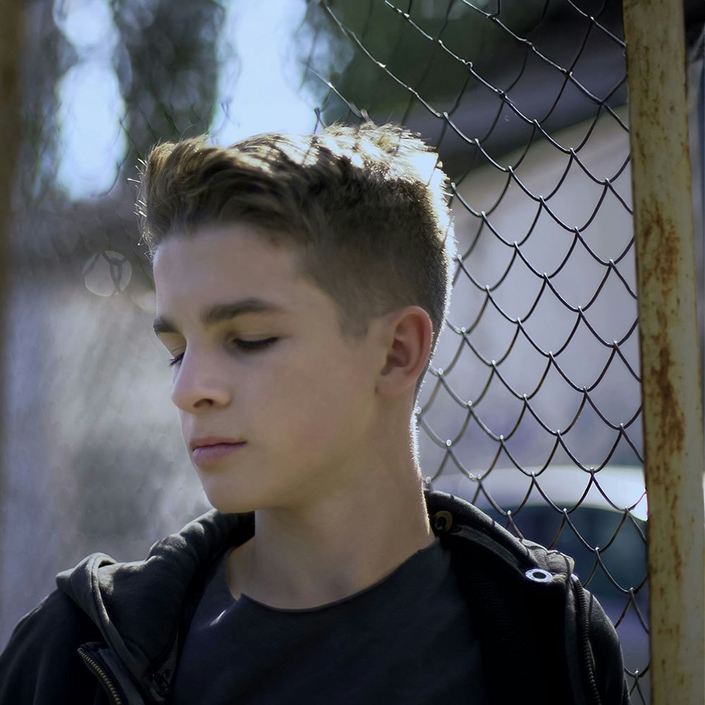 Minor leaning on fence