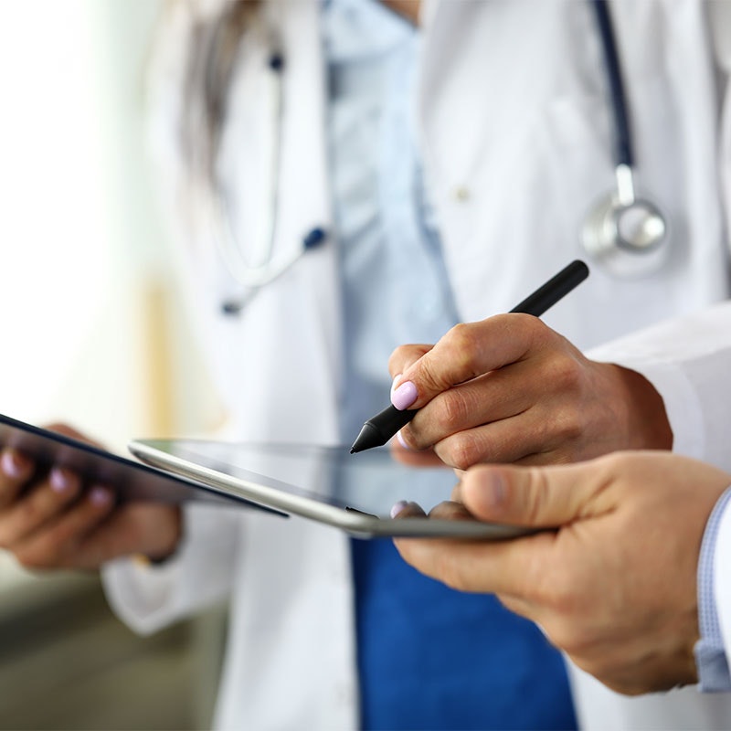 healthcare professional taking notes