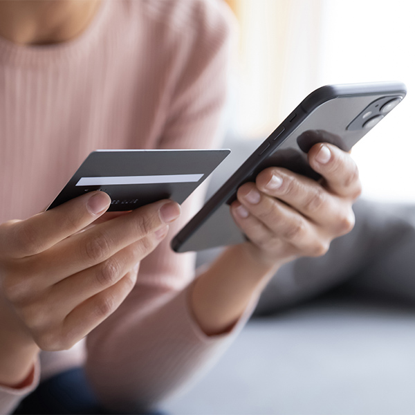 a woman using online banking with her phone