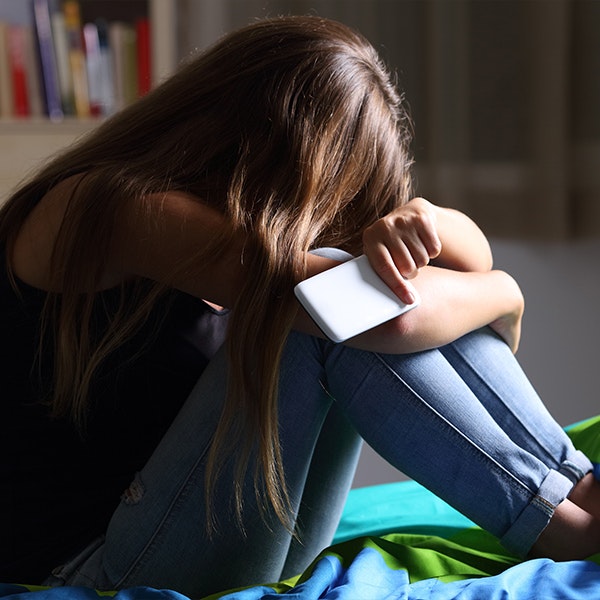 Girl being cyberbullied