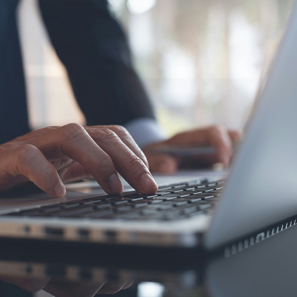 hands using a laptop