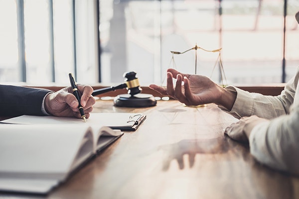 Attorney and client discussing a public lewdness case