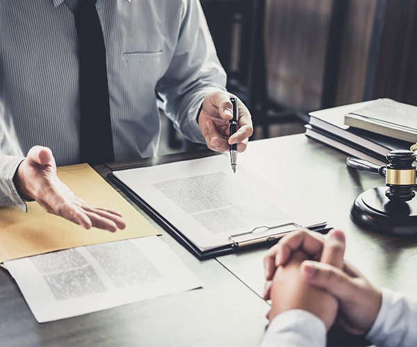 Defense attorneys going over paperwork