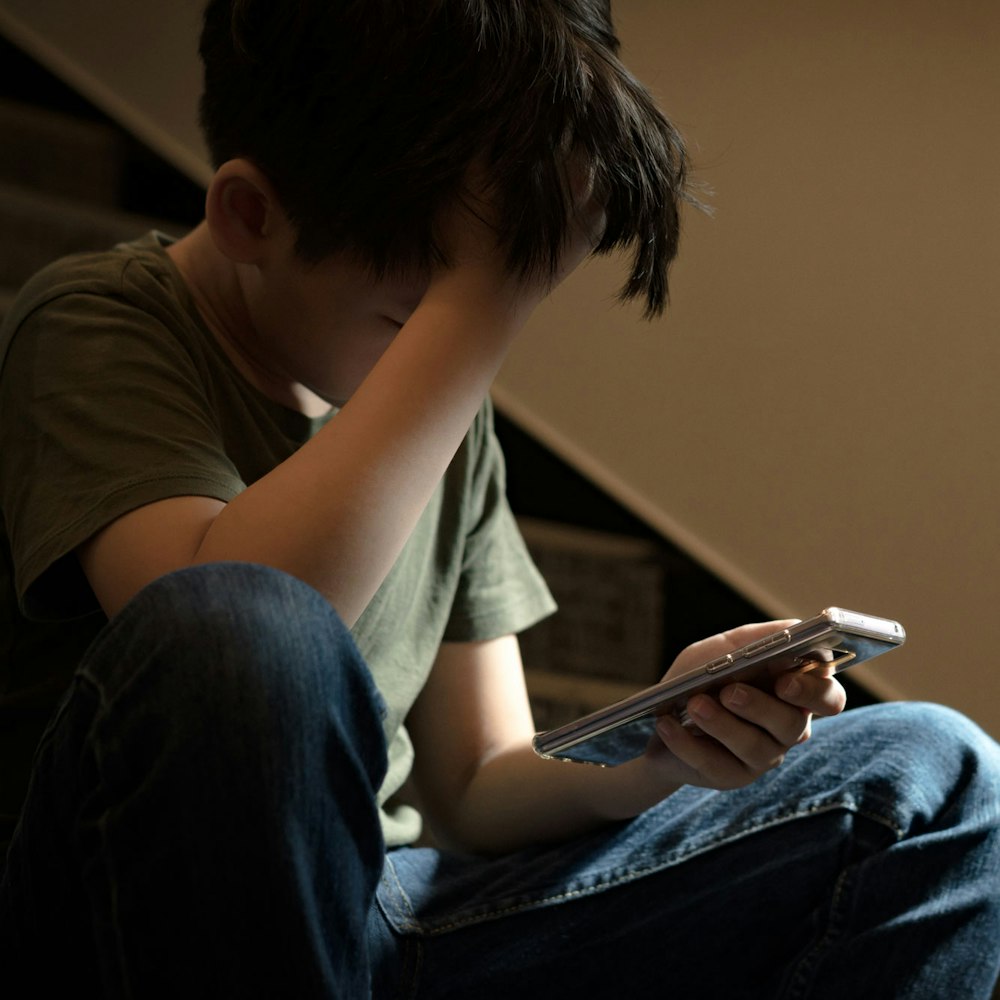 boy being cyberbullied