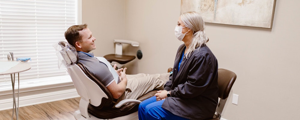 Prattville, AL, gum disease patient speaking with dentist