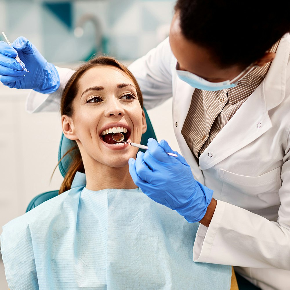 Dental hygienist with patient