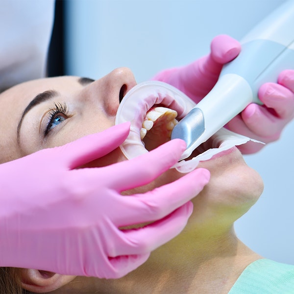female patient receiving an intraoral scan