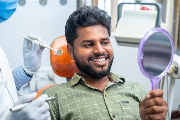 Smiling man in dental chair