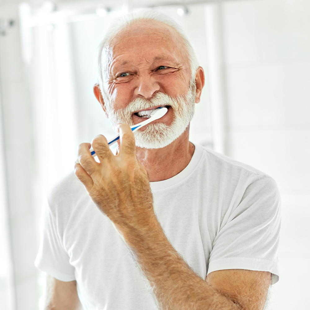 a man brushing his teeth