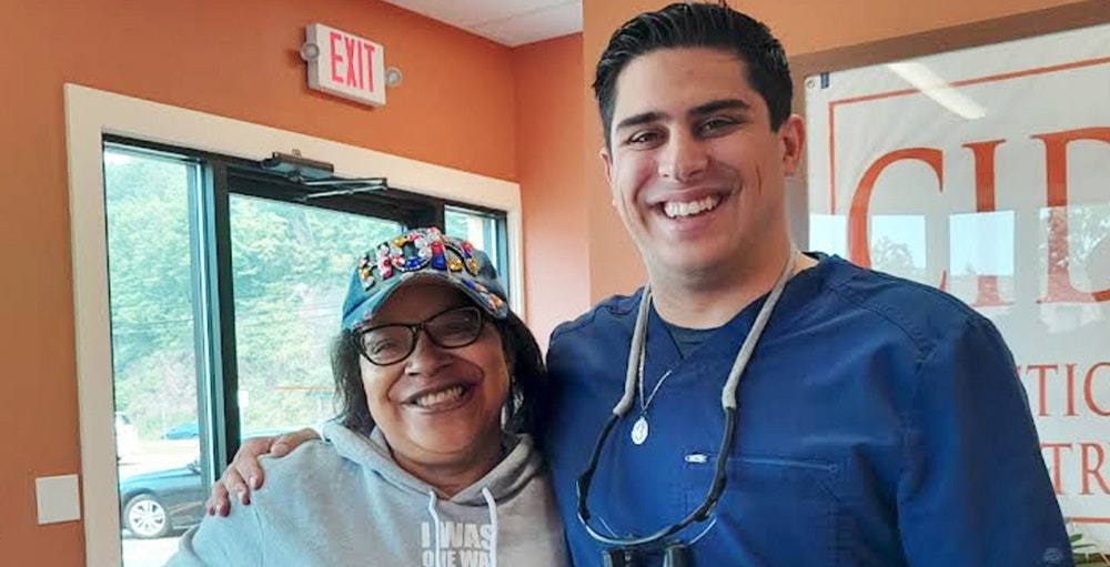 Dr. Dominic Gambino smiling with patient