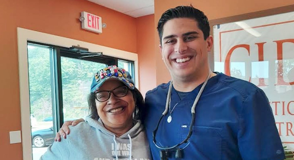 Dr. Dominic Gambino smiling with patient