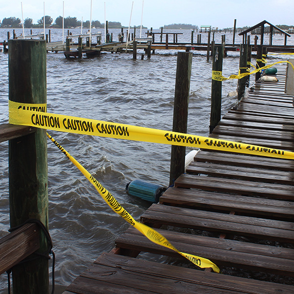 Caution tape around a dock that looks unsafe