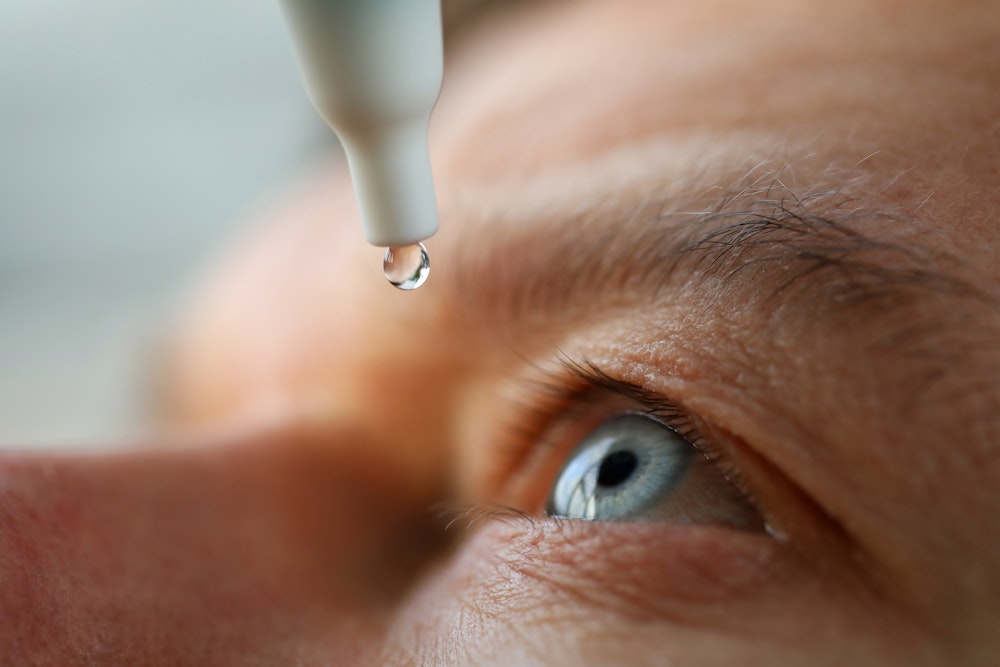 Close-up of eye drops being applied