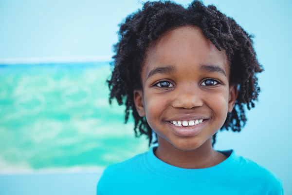 young boy in blue shirt