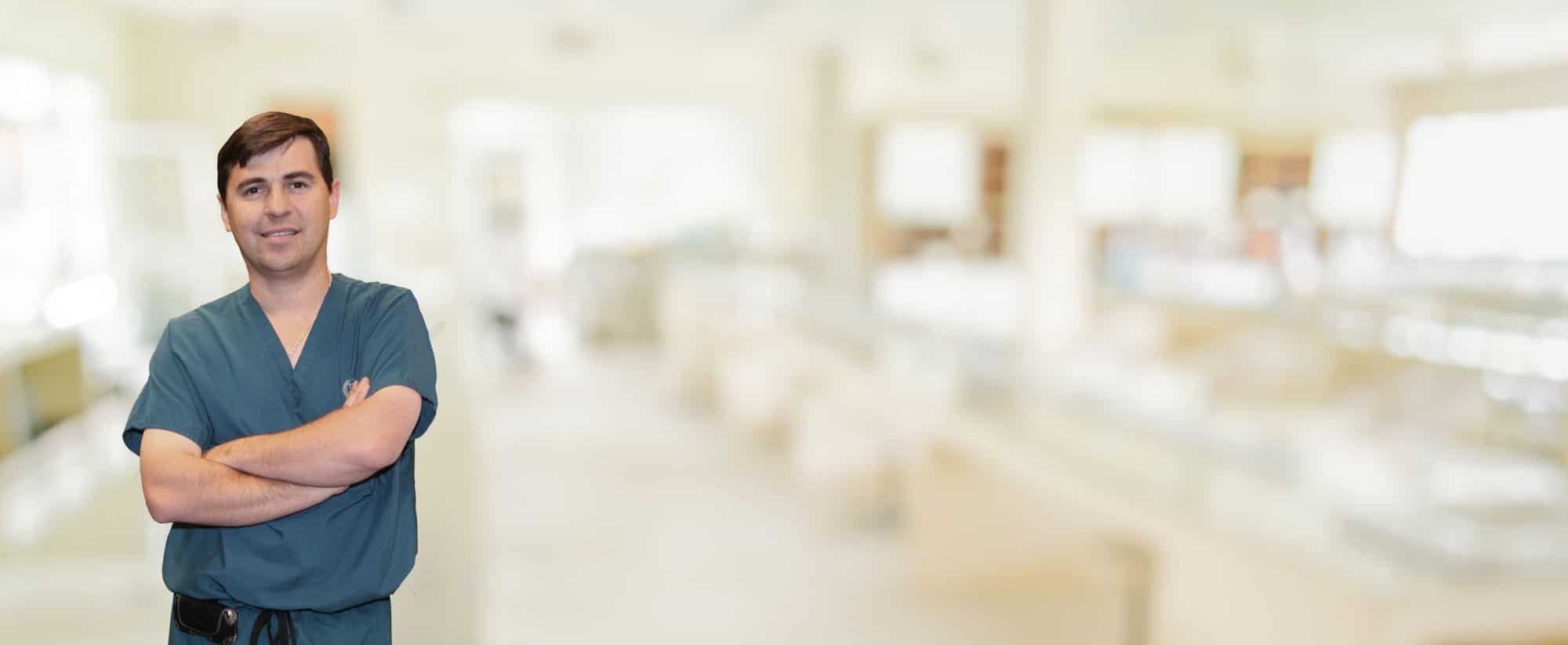 Dr. Arturo Bonilla in front of a clinical laboratory