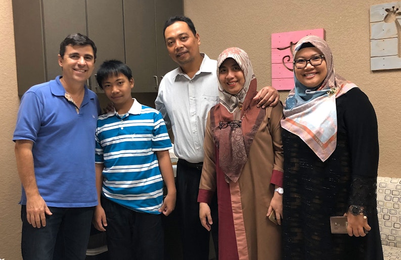 Dr. Arturo Bonilla with a Microtia patient and his family after surgery