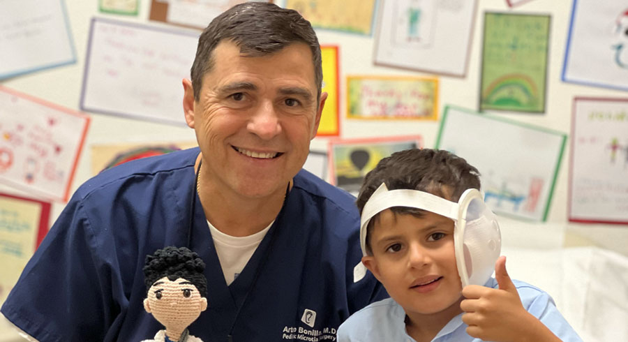 Dr. Arturo Bonilla with a microtia patient